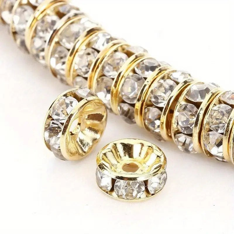 Distantiere rondele aurii cu strasuri albe 6x2mm