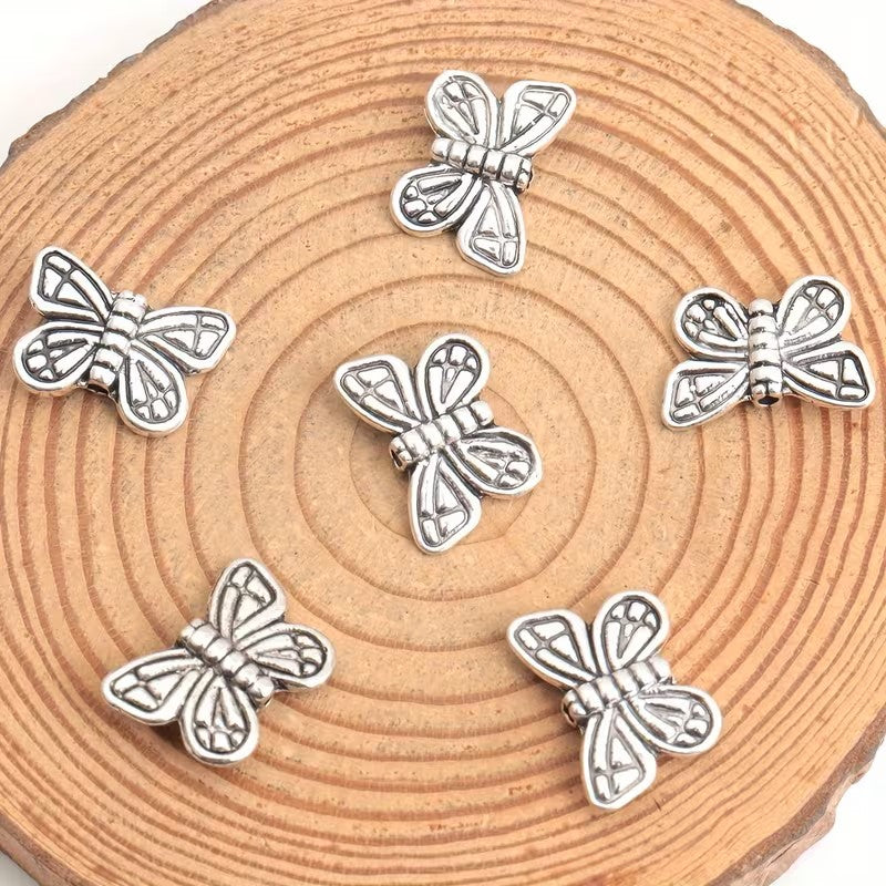 Margele metalice fluture 10x15mm argintiu