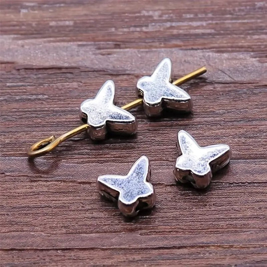 Margele metalice fluture 5x6mm argintiu