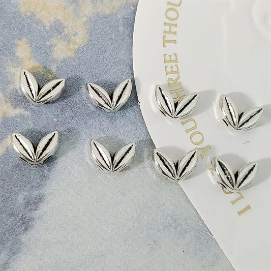 Margele metalice frunzulite 7x5mm argintii