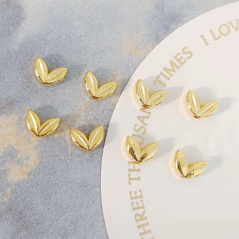 Margele metalice frunzulite 7x5mm aurii