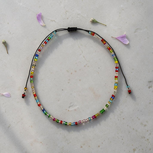 Bratara de picior reglabila cu margele de nisip multicolor - snur negru