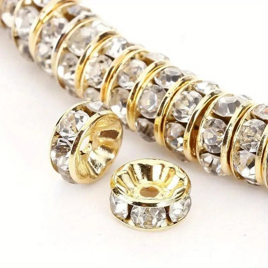 Distantiere rondele aurii cu strasuri albe 8x3mm