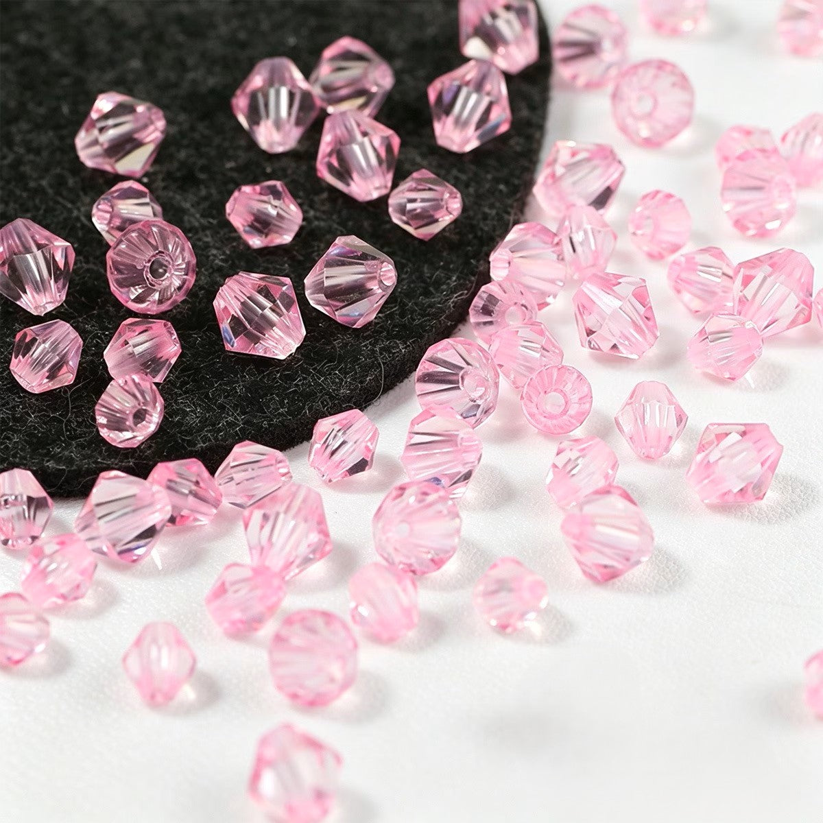 Margele acrilice biconice 4mm roz