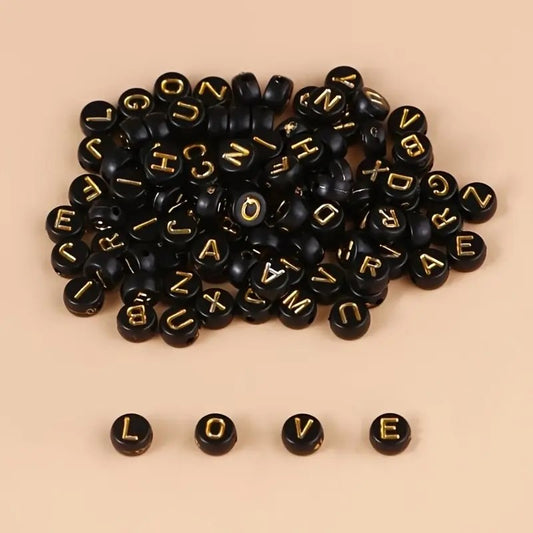 Margele acrilice negre cu litere aurii 6mm