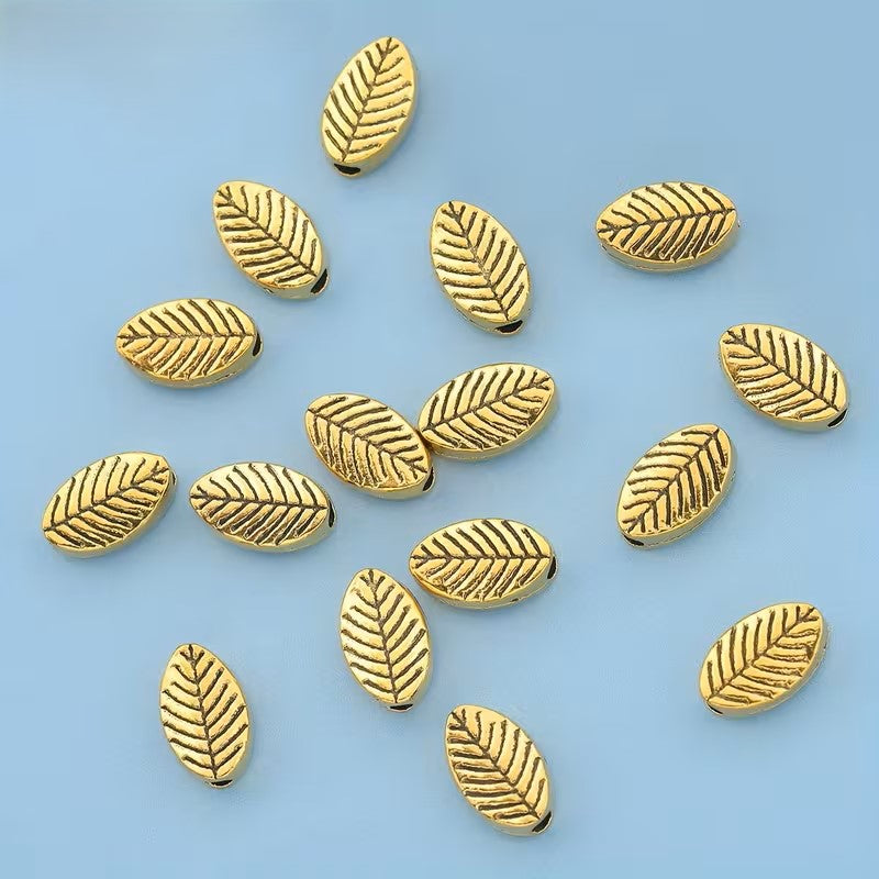 Margele metalice frunza 9x6mm auriu