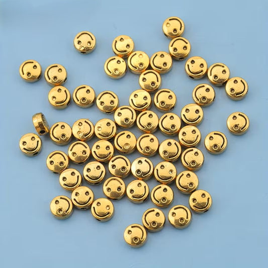 Margele metalice zambet 6mm auriu